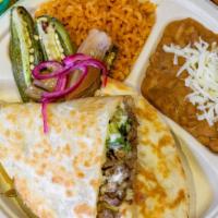 Quesadilla Catrina · Served with rice, beans, cilantro, onions, and salsa.