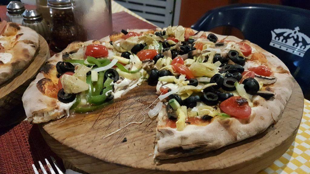 Vegetarian · Pizza sauce, mozzarella cheese, onion, mushrooms, black olives and green peppers.