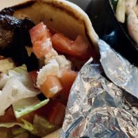 Gyro (Lamb & Beef) Sandwich · Comes with lettuce, tomato, onion, feta cheese and tzatziki sauce in pita bread served with ...