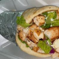 Chicken Gyro Sandwich · Comes with lettuce, tomato, onion, feta cheese and tzatziki sauce in pita bread served with ...