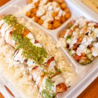 Salmon Kebab Platter · Comes with rice, two sides, and pita bread. Drizzled with white sauce, chutney sauce and spr...
