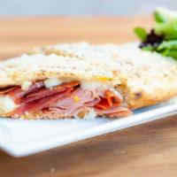 Italian Sandwich · Puccia bread, mozzarella, ricotta, hot soppressata and dry meats, basil - parmigiano reggiano