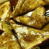 Texas French Toast · Three slices of old-fashioned flat top grilled French toast made with Texas toast topped wit...