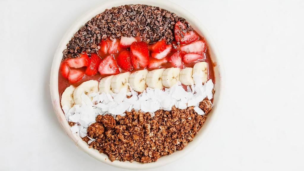 Acai Bowl · housemade almond milk, acai, banana, strawberry and date. // topped with banana, cacao nibs, strawberry, coconut, toasted almond crumble