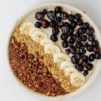 Coco-Nut-Butter Bowl · housemade coconut milk, banana, almond butter, date. // topped with blueberry, raspberry, to...