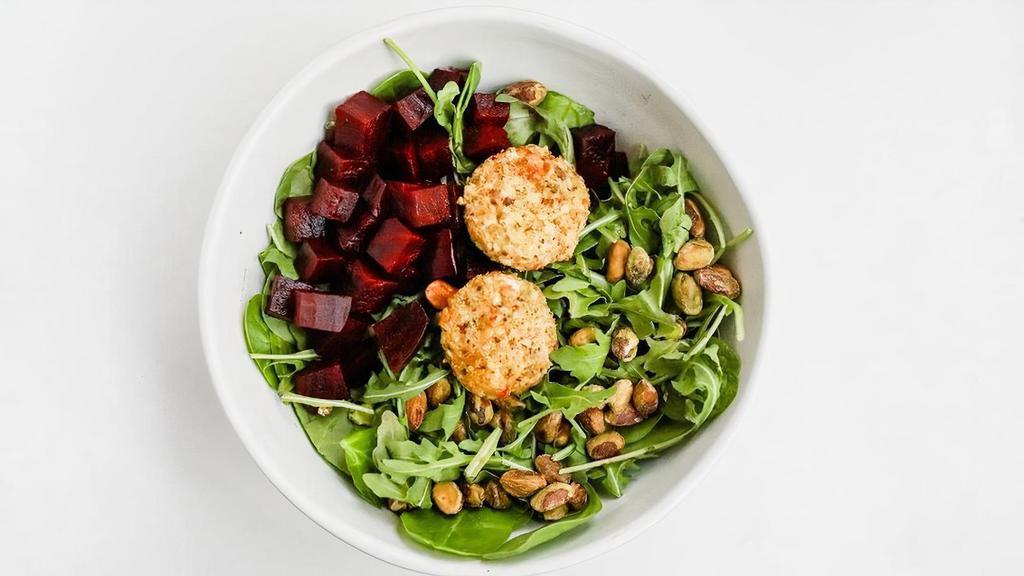 Arugula & Beet Salad · arugula, spinach, beets, pistachios, pistachio dusted goat cheese medallions. dressing: roasted carrot vinaigrette (unless another dressing is selected) . suggested add-ons: chicken, bacon, avocado