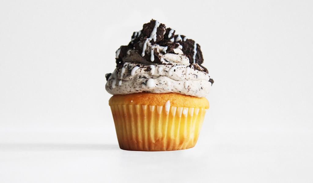 Cookies N' Cream · Classic Vanilla Cake with Cookies n' Cream Cheese frosting, Crushed Oreo's, and a White Chocolate Drizzle