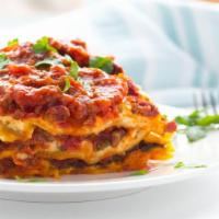 Baked Meat Lasagna · Small garden salad, garlic bread, marinara, and meatballs.