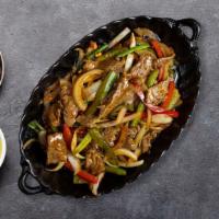 Pepper Steak · Flank steak with bell peppers and onions.