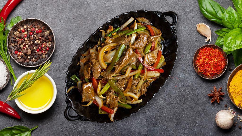 Pepper Steak · Flank steak with bell peppers and onions.