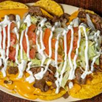 Nachos Large (Grandes) · Comes with: lettuce, tomato, sour cream, beans, avocado, and cheese (lechuga, tomate, crema,...
