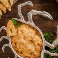 Crab Dip · Just George's creamy homemade dip with sweet jumbo lump crab meat. Served with warm pita wed...