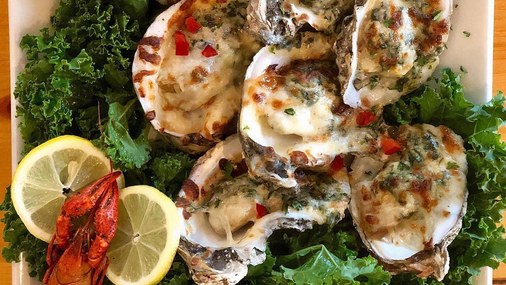 Oysters Rockefeller · George's own recipe! Five oysters stuffed with a creamy spinach and applewood bacon mixture, topped with mozzarella cheese and baked golden brown.