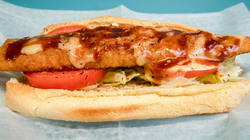 Whiting Fish Po Boys · Served with lettuce, tomato, and Cajun seasoning.