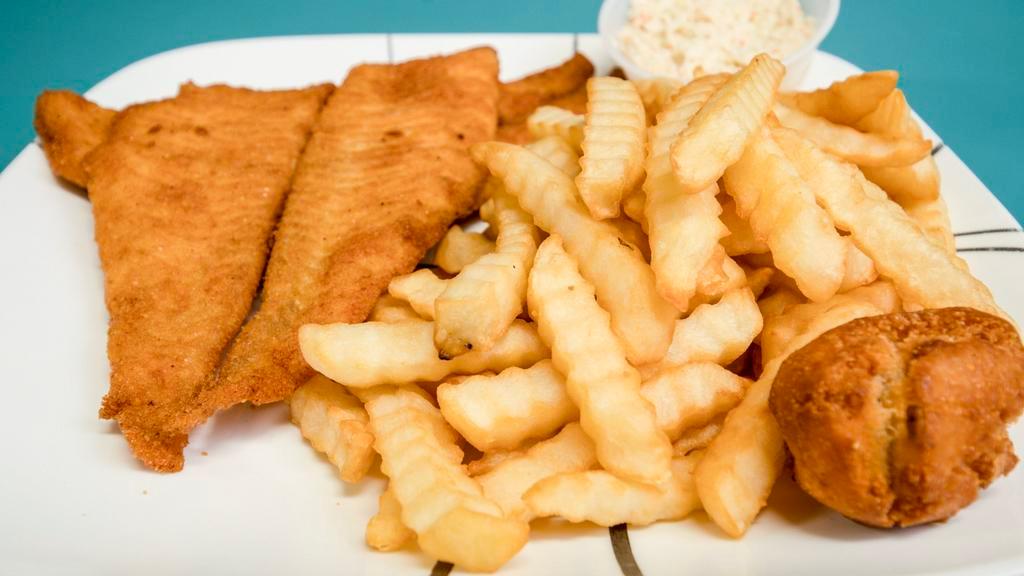 Flounder Fillet Dinner · Includes a hushpuppy, French fries.