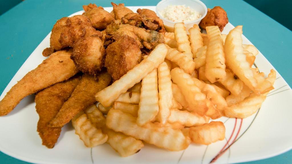 Fish, Shrimp, Scallop, & Oyster · Includes hush puppies, French fries.