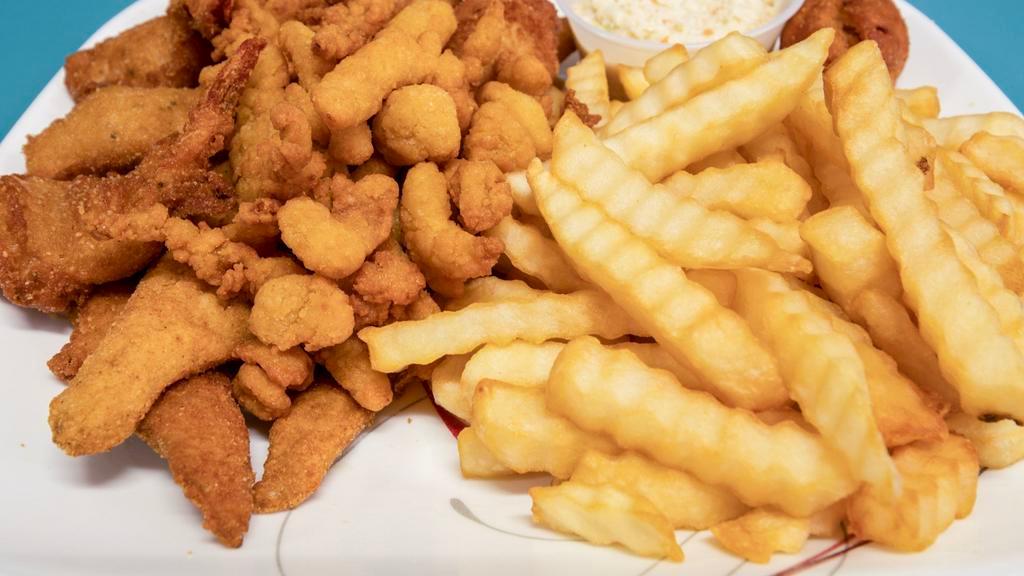 Shrimp & Clam Strips · Six pieces of shrimp and eight oz clam strips. Includes hush puppies, French fries.