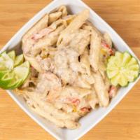 Chicken Rasta Pasta · Creamy Jerk spiced penne pasta combined w/ peppers and a white parmesan sauce and chicken