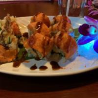 Dragon Roll · Shrimp tempura, cream cheese inside, topped with eel, avocado, mango and eel sauce.