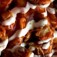 Buffalo Chicken Fries · chicken, cheese, mild sauce, ranch  on bed of season fries.