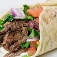 Beef Shawarma · Greek salad, hummus, tahini, pita.