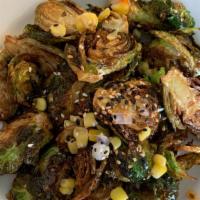 Blasted Brussel Sprouts · Pepper jelly glaze, roasted corn, sesame seeds