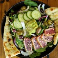 Aegean Tuna Salad · Seared sushi-grade ahi tuna, avocado, tomato, pickled red onion, lemon, marinated olives, mi...