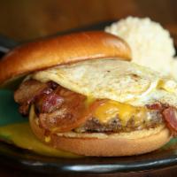 Eye-Opener Burger · Angus beef patty, over-easy egg, bacon, cheddar, spicy Cajun mayo, and brioche bun.
