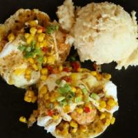 Eggs Flamingo · English muffin, BBQ Gulf grilled shrimp, over-easy eggs, and corn salad.