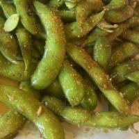 Spicy Garlic Edamame · Steamed soy beans, tossed with spicy garlic butter sauce.