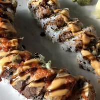 Surf & Turf Roll · Shrimp tempura, avocado, cucumber, cream cheese inside, topped with Seared white fish and be...