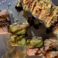 Bacon Roll · Fried bacon, shrimp tempura and cream cheese inside, topped with Seared salmon, avocado and ...
