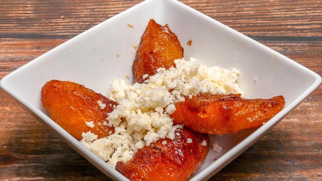Side Of Sweet Plantains · Product of Costa Rica! 4 sweet plantains (platanos maduros) topped with queso fresco (fresh white crumble cheese) (GF)