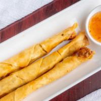 Long Life Roll (3) · Crispy long roll stuffed with chicken & thai herbs served with sweet chili sauce.