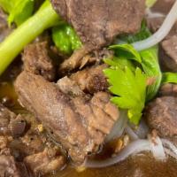 Beef Noodle · Rice and bean in beefbroth, topped with celery.