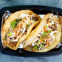 Specialty Tacos (2) · Each taco prepared with meat, rice blend, coleslaw or veggies and topped with herbs and 