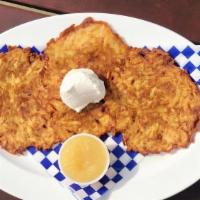 Kartoffelpuffer · Potato Pancakes are a popular German appetizer made in house daily. Fresh potatoes cooked pe...