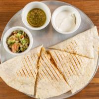Quesadilla · Your choice of meat or veggies in a fold flour tortilla and served with guac, salsa and sour...
