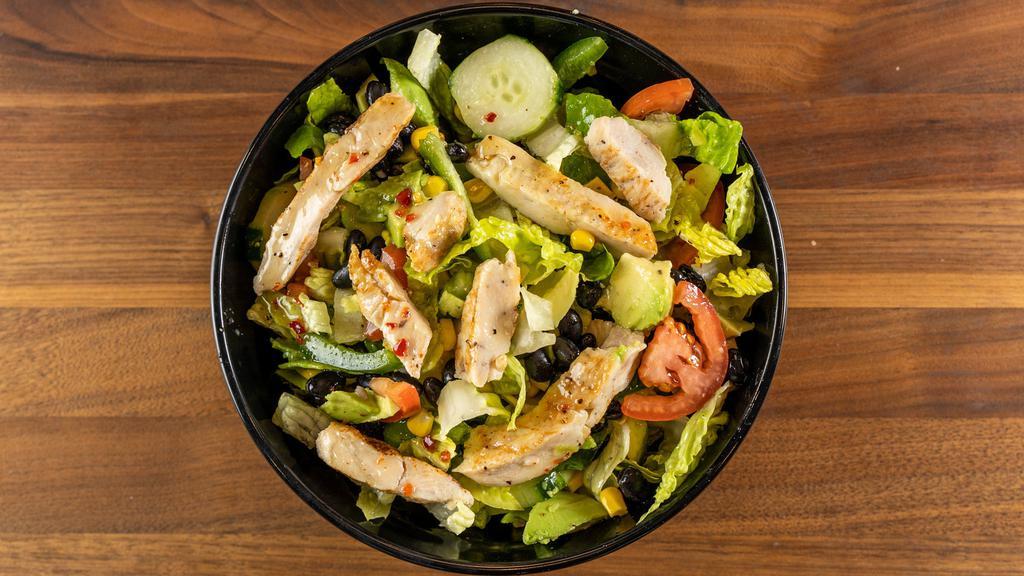 Mexican Salad · Grilled chicken, romaine lettuce, avocado, tomato, black beans, green peppers, corn and cucumber, served with lime dressing.