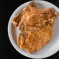 Pork Chops · Two juicy chops grilled or fried to perfection with your choice of two sides.