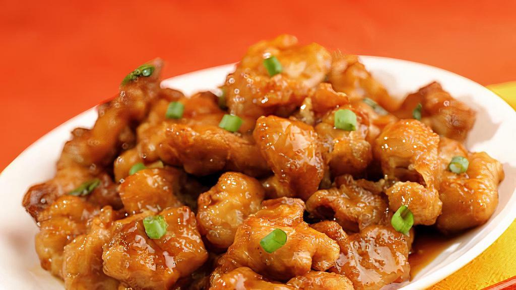 Orange Chicken · Hot chunks of chicken sauteed with orange peel in a spicy sauce. With white rice. Hot and spicy.