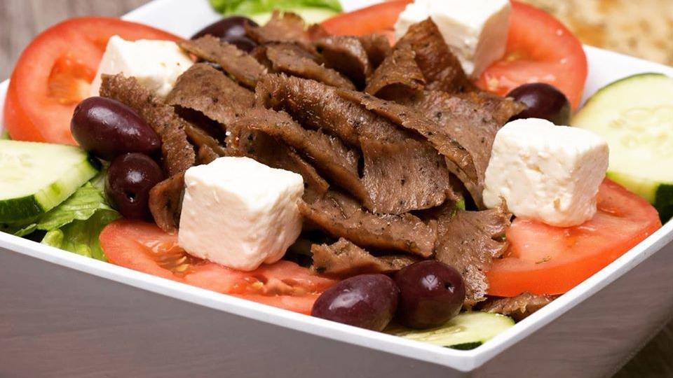 Greek Salad · Lettuce, Tomatoes, Cucumbers, Onions, Feta Cheese, Greek Olives, and a Pita.