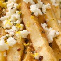 Greek Fries · Fries topped with crumbled feta, olive oil, and oregano.
