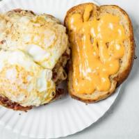 Old Man · Reuben sandwich with two dripping over easy eggs.
