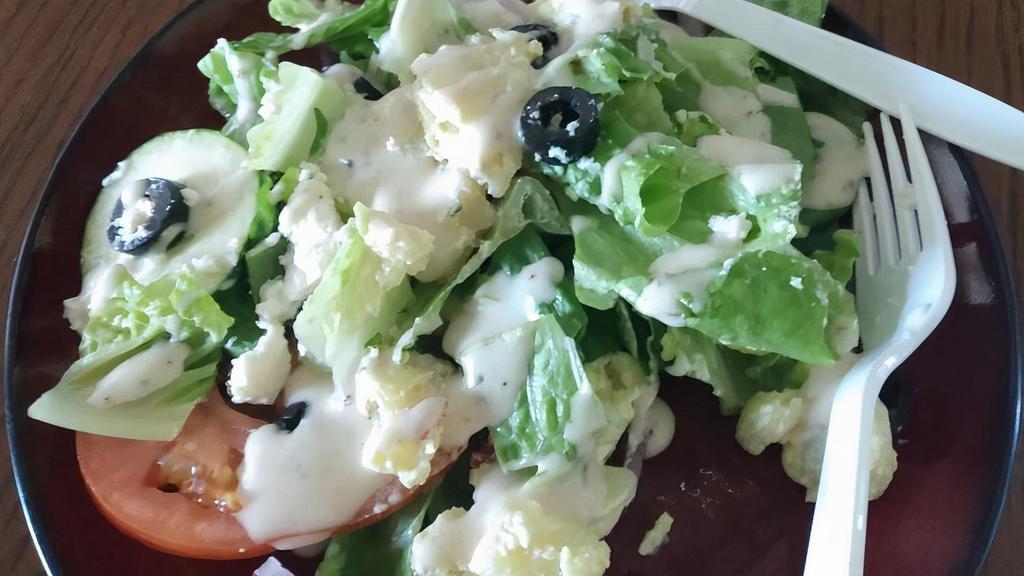 Greek Salad · Greek Dressing ,Romaine lettuce, tomato, cucumbers, green peppers, Black olive and Feta cheese
