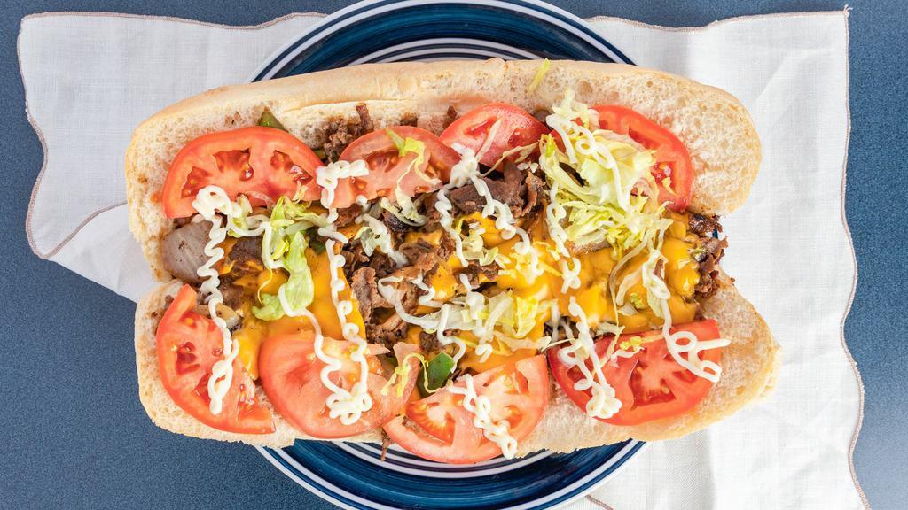 Philly Cheesesteak · Steak, grilled onions, green peppers and provolone  cheese.