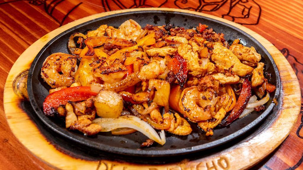 Fajita Tropical · Shrimp, chicken, and chorizo, cooked with yellow and red bell peppers, onions and pineapple.