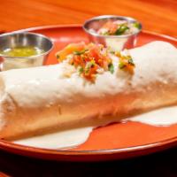 Burrito Michoacano · Extra large burrito filled with carnitas (pork), rice, and beans. Topped with cheese sauce a...