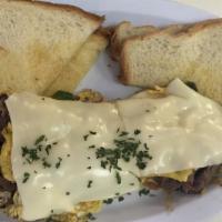 Ribeye Steak Philly Omelet · 3 eggs, philly steak, green peppers, onions and cheese.