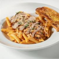 Grilled Chicken Pasta (Half Portion) · Grilled chicken tossed with penne pasta in a choice of sauce: (where available) Garlic Cream...